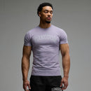 VANQUISH FITNESS Revolveモデル アーチ ライラックスモーク スリムフィットTシャツ